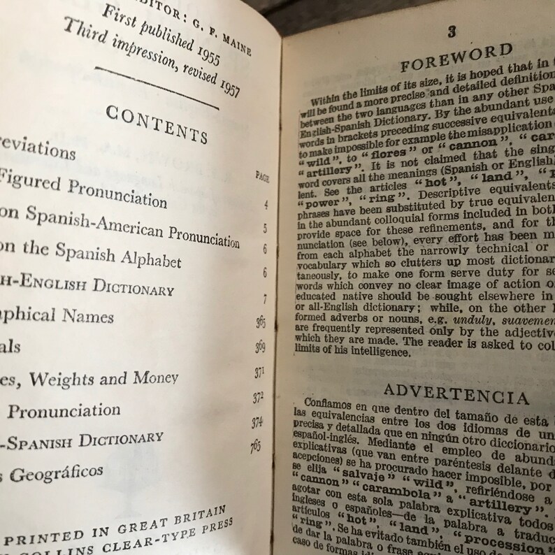 May include: A page from a Spanish-English dictionary with the title "Foreword" and "Contents" listed. The text is in black and white and the page is yellowed with age.