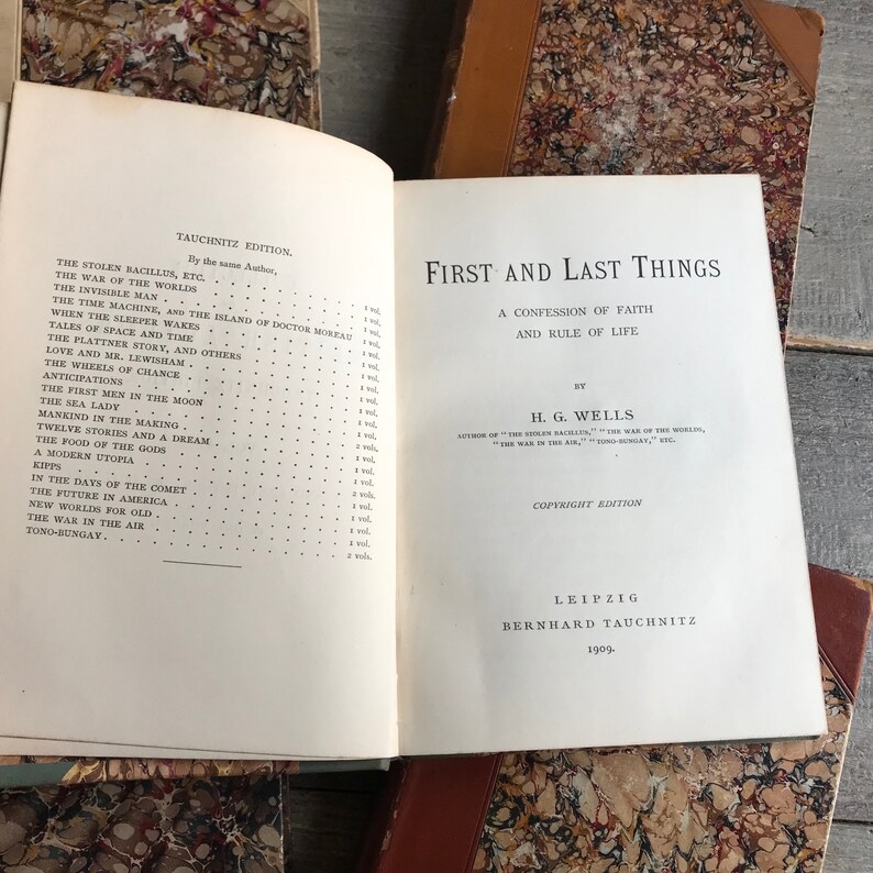 May include: A vintage book titled "First and Last Things: A Confession of Faith and Rule of Life" by H.G. Wells. The book is a copyright edition published in 1909 by Bernhard Tauchnitz in Leipzig.