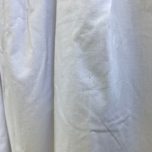 May include: White fabric with two small holes.