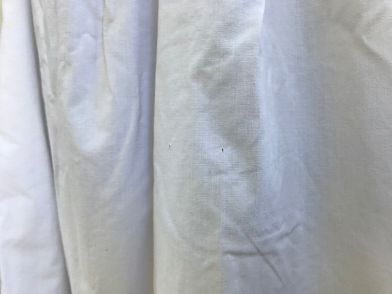 May include: White fabric with two small holes.