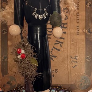 friendly witch with her poison apple and her broom ready to fly away