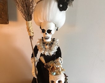 Witch skeleton , potions, books, broom with top hat. Skeleton dressed for the day of witchy things. Free shipping