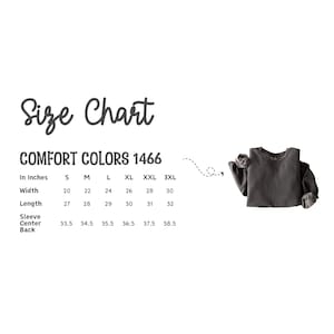 May include: A size chart for Comfort Colors 1466 long-sleeve shirts, displaying measurements in inches for sizes S through 3XL. The chart lists width, length, and sleeve center back dimensions, accompanied by a dark gray long-sleeve shirt graphic.
