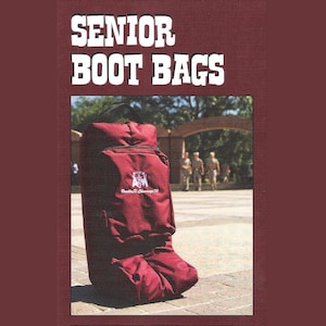 May include: A maroon boot bag with a zippered pocket and a white embroidered logo that says "Texas A&M" and "Bradley D. Shuman '90".