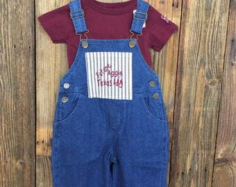 Future Aggie Long Overalls with WHOOP on back.