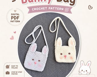 May include: A digital PDF crochet pattern for a Bunny Bag. The image displays two small, handmade crocheted bags with bunny ears, brown eyes, and pink noses. One bag is light gray, and the other is cream-colored, both featuring long shoulder straps.