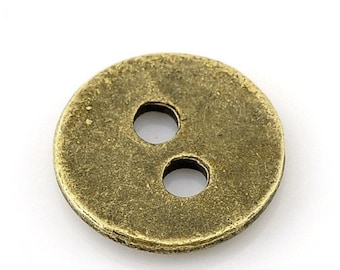 May include: A two-hole, round, brass button with a slightly textured surface.