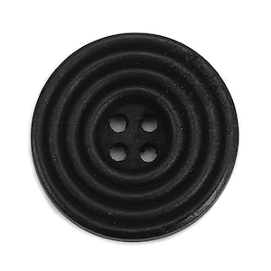 May include: Black wooden button with four holes and a concentric circle design.