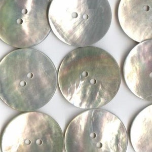 May include: Ten round, white mother of pearl buttons with two holes each.