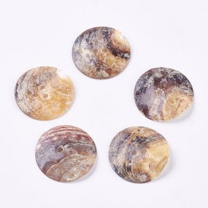 May include: Five round, brown and beige shell buttons with two holes each. The buttons have a natural, marbled pattern.