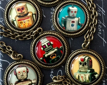 May include: A set of seven necklaces featuring vintage robot illustrations encased in round, bronze-colored pendants. Each pendant has a different robot design with varying colors and details.
