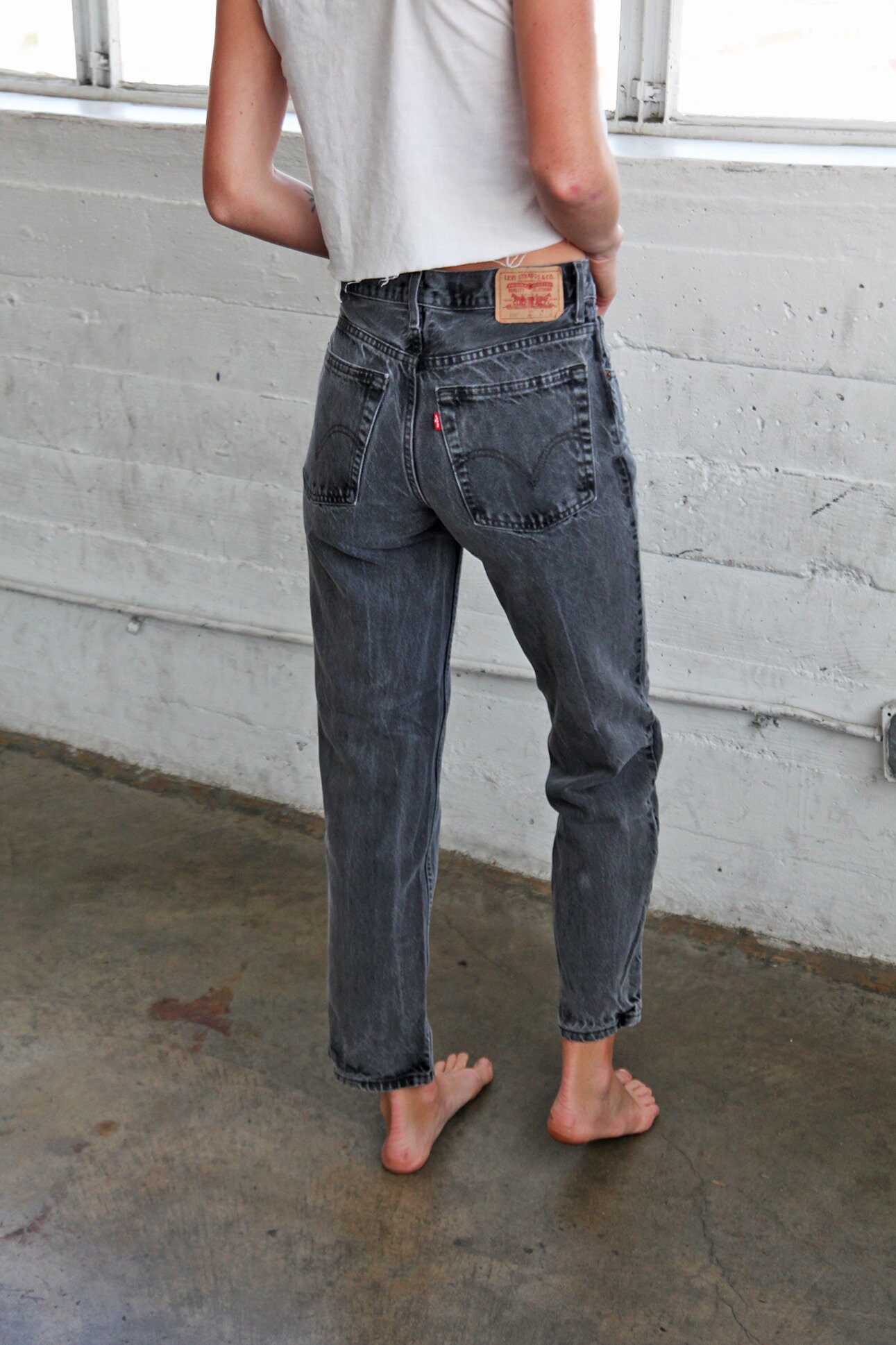 ripped jeans with fabric underneath