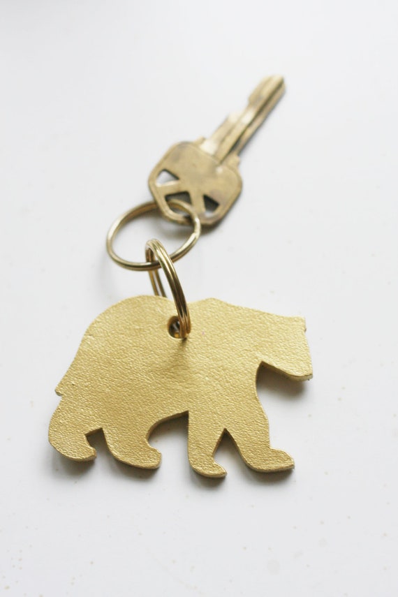 Items similar to golden bear keychain on Etsy