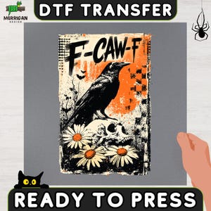 May include: A DTF transfer sheet featuring a graphic design with a black raven perched on a skull, surrounded by white daisies. The background includes orange and black distressed textures, a checkered pattern, and the text F-CAW-F in black.