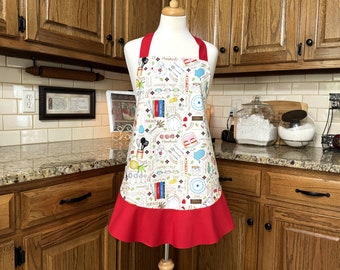 Baking Apron with cake, utensils and baking items.  Perfect apron to plan for the picnic!