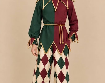 May include: A jester costume featuring a two-toned tunic in dark green and burgundy with gold trim and bells. The pants have a cream, green, and burgundy diamond pattern with gathered cuffs. Includes a matching two-toned jester hat with bells.