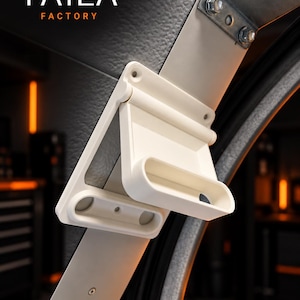 May include: A white, hinged, L-shaped plastic handle mounted on a metal frame with visible bolts. The handle features a rectangular grip section and a flat base plate with screw holes. The text TAILA FACTORY is visible in the upper left corner.