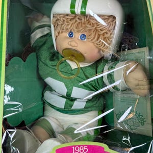 Bambola vintage Cabbage Patch Kids Rory Sparky, giocatore di football, del 1985, nuova nella sua scatola originale.