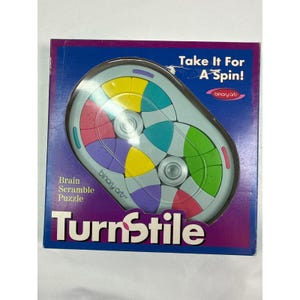 May include: A square box for the TurnStile Brain Scramble Puzzle by Binary Arts. The box features a purple background and a graphic of an oval-shaped puzzle with rotating segments in yellow, pink, purple, and green. Text reads Take It For A Spin!