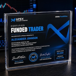 May include: A rectangular clear acrylic plaque featuring a black and blue certificate for Apex Trader Funding. The text reads Certified Funded Trader, Alexander Johnson, August 05, 2026, and includes signatures, a circular seal, and a payment amount of $3,000.
