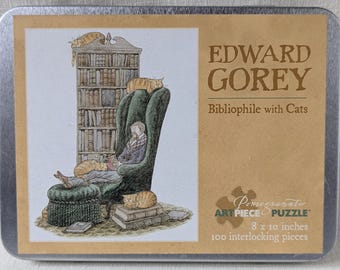 Puzzle Edward Gorey Bibliophile avec chats, 100 pièces, 20 x 25 cm (Œuvre d'art Grenade)