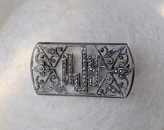 Broche ancienne Ciner Art Déco en argent massif et marcassite, monogramme AJS