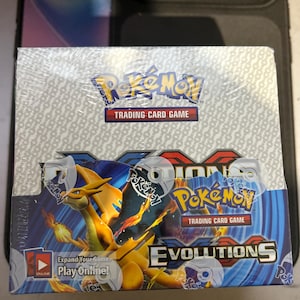 evolutions booster box fake EVORETRO Acrylic Case Protector for Pokemon Discover their unique new powers as Stellar Tera Pokmon ex How to Spot Fake Pokmon