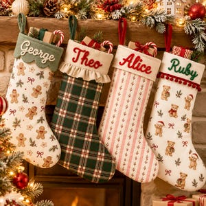 May include: Four personalized Christmas stockings hanging in a row. The first is cream with gingerbread men, the second is green plaid with a ruffled cuff, the third is striped with red embroidery, and the fourth is cream with teddy bears.