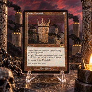 Puede incluir: Una carta coleccionable de Magic: The Gathering titulada Grim Monolith, que presenta una ilustración de una torre de piedra alta y desgastada. El texto de la carta incluye el nombre, coste de maná, tipo artefacto, reglas y el texto de ambientación Part prison, part home.