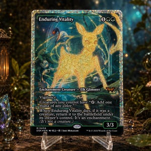 May include: A rectangular trading card titled Enduring Vitality featuring a golden, glowing elk illustration. The card text includes Enchantment Creature - Elk Glimmer, Vigilance, and game rules. It has a holographic foil finish and a 3/3 power and toughness.