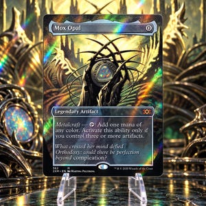 May include: A holographic Mox Opal trading card featuring a dark, intricate illustration of a glowing, multi-colored gemstone set in a metallic frame. The card text includes the name Mox Opal, the cost 0, and the ability Metalcraft.