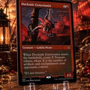 May include: A rectangular trading card titled Dockside Extortionist, featuring a red border and an illustration of a goblin pirate. The card text describes the creature's ability to create Treasure tokens. It has a power and toughness of 1/2.