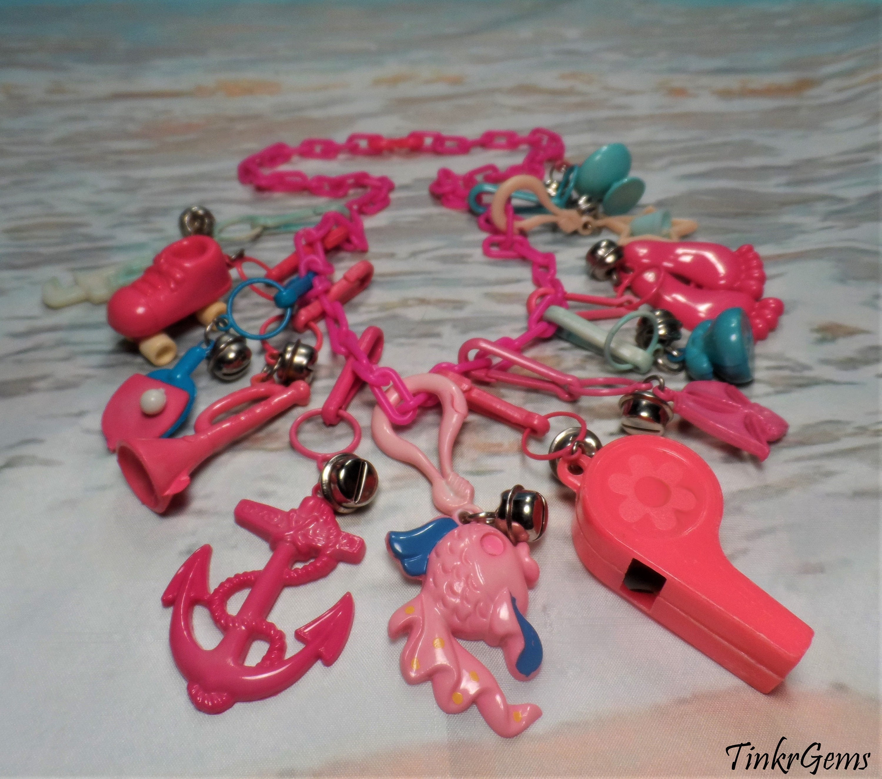 1980's Clip Charms With Bells, Fish, Anchor, Ice Cream, Feet, Skate and  More on Hot Pink Plastic Chain Necklace 