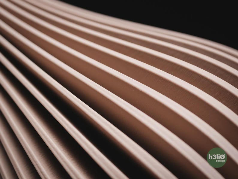 May include: A series of parallel, light beige, curved ridges arranged in a repeating pattern that recedes into the distance. The surface has a smooth, matte texture. A small, circular green logo with the text h3li&oslash; design is in the corner.