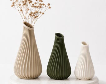 Jarrón Lagos: Jarrón escultural moderno impreso en 3D con diseño orgánico y fluido para flores secas.