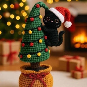 May include: A crocheted amigurumi set featuring a black cat wearing a red and white Santa hat, climbing a green cone-shaped Christmas tree decorated with small red and yellow pom-poms, all set in a textured mustard yellow pot with a red bow.