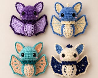 May include: Four crocheted bat plushies with large black eyes and pink cheeks. One is purple, one is blue and cream, one is teal and peach, and one is cream and dark blue with white star embroidery on the wings. Each has pointed ears and wings.