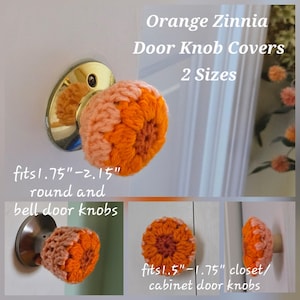 May include: Crocheted orange zinnia door knob covers in two sizes. The covers feature a flower-like design in shades of orange and peach. Text indicates they fit 1.75-inch to 2.15-inch round and bell door knobs, and 1.5-inch to 1.75-inch cabinet knobs.