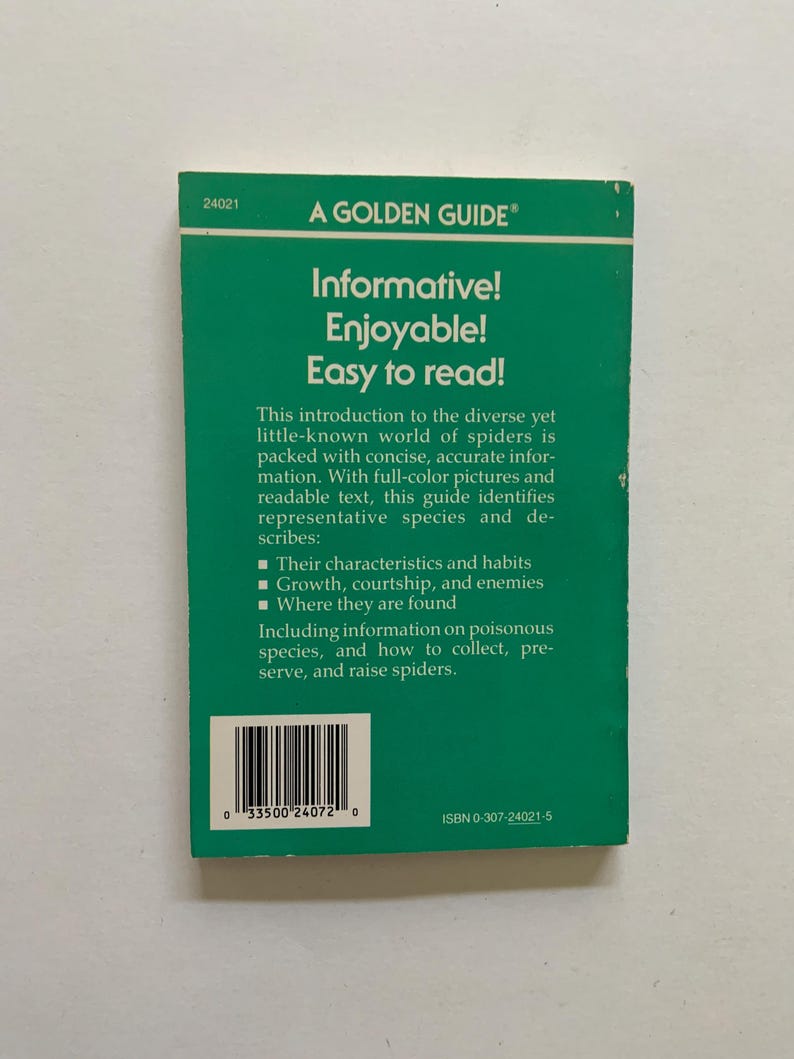 May include: The back cover of a green A Golden Guide book about spiders. It features the text: Informative! Enjoyable! Easy to read! This introduction to the diverse yet little-known world of spiders is packed with concise, accurate information. A barcode and ISBN 0-307-24021-5 are printed at the bottom.