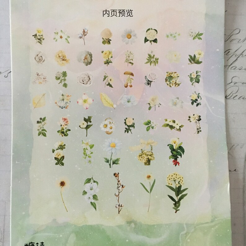 以下が含まれることがあります： 白い紙に様々な花のステッカーが貼られています。ステッカーはグリッド状に配置されており、バラ、デイジー、ユリなど、様々な種類の花が描かれています。紙は薄い緑色の背景で、水彩画のような効果が施されています。