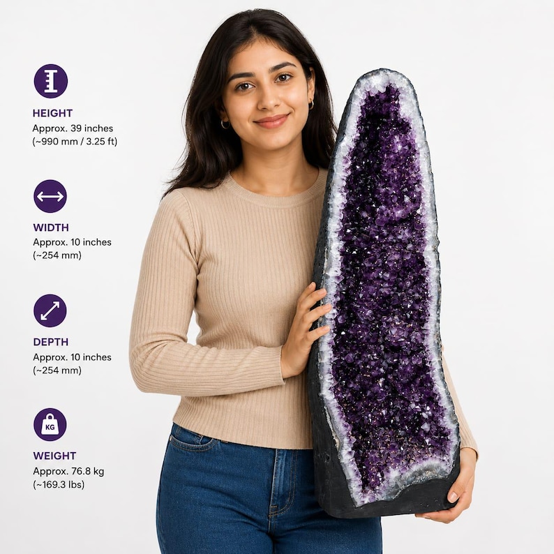 May include: A large, tall amethyst geode with deep purple, crystalline interior and a dark, rough exterior. The geode measures approximately 39 inches in height, 10 inches in width, 10 inches in depth, and weighs approximately 169.3 lbs.