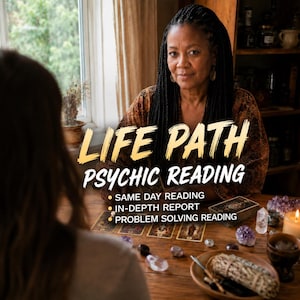 May include: A person with long dark braided hair sits at a wooden table with tarot cards, crystals, and a sage bundle. Text reads: LIFE PATH PSYCHIC READING, SAME DAY READING, IN-DEPTH REPORT, PROBLEM SOLVING READING. The setting includes a window.