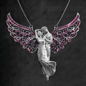 May include: A silver-toned pendant necklace featuring two figures in an embrace, positioned in front of large, intricate wings adorned with numerous small, vibrant pink gemstones. The pendant hangs from a delicate silver chain against a dark background.
