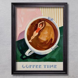 May include: A framed art print featuring a large white coffee cup filled with dark brown liquid. A person in a red swimsuit and cap is swimming in the coffee. The background has pink, yellow striped, and green sections. The text COFFEE TIME is at the bottom.