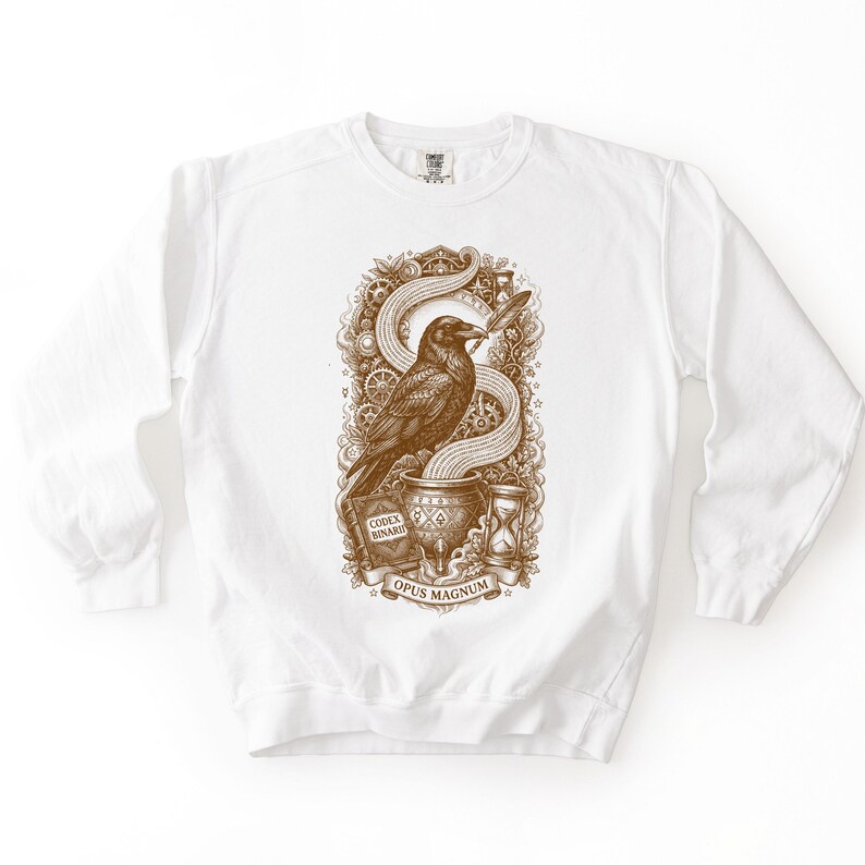 White computer science sweatshirt showing a brown vintage gothic etching of a raven, gears, and binary code.