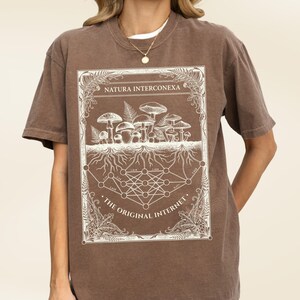 Dark brown vintage biology tee displaying a white mushroom and math nodes graphic.