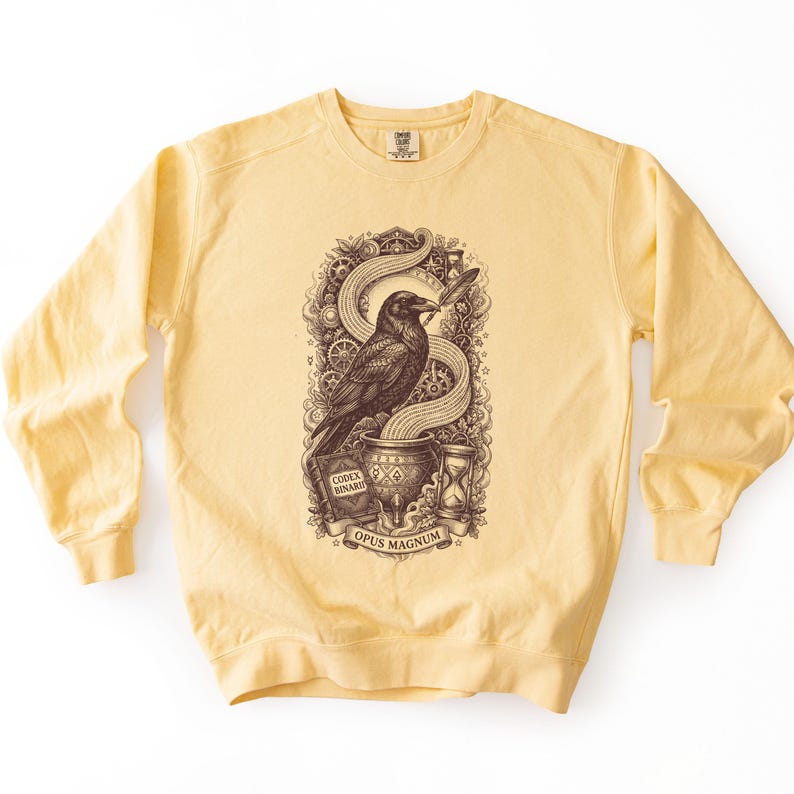 Soft yellow dark academia clothing sweatshirt featuring a brown vintage Edgar Allan Poe vibe raven print.