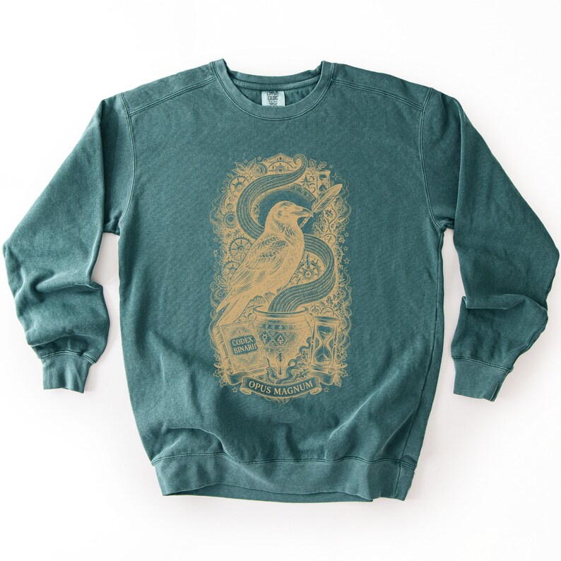 Pine green tech humor sweatshirt displaying a dark red vintage bird art print with a cauldron of binary code.