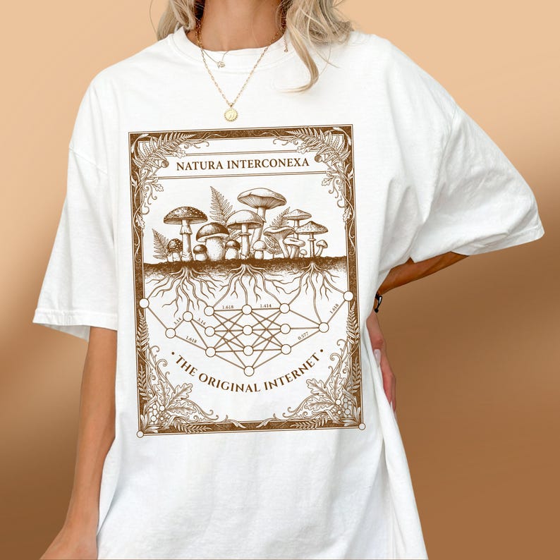 White nature tech t-shirt worn by a woman, showing a brown mycology geometry graphic.