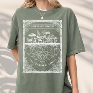 Olive green data scientist t-shirt mockup with a white mycelium network tech engraving.